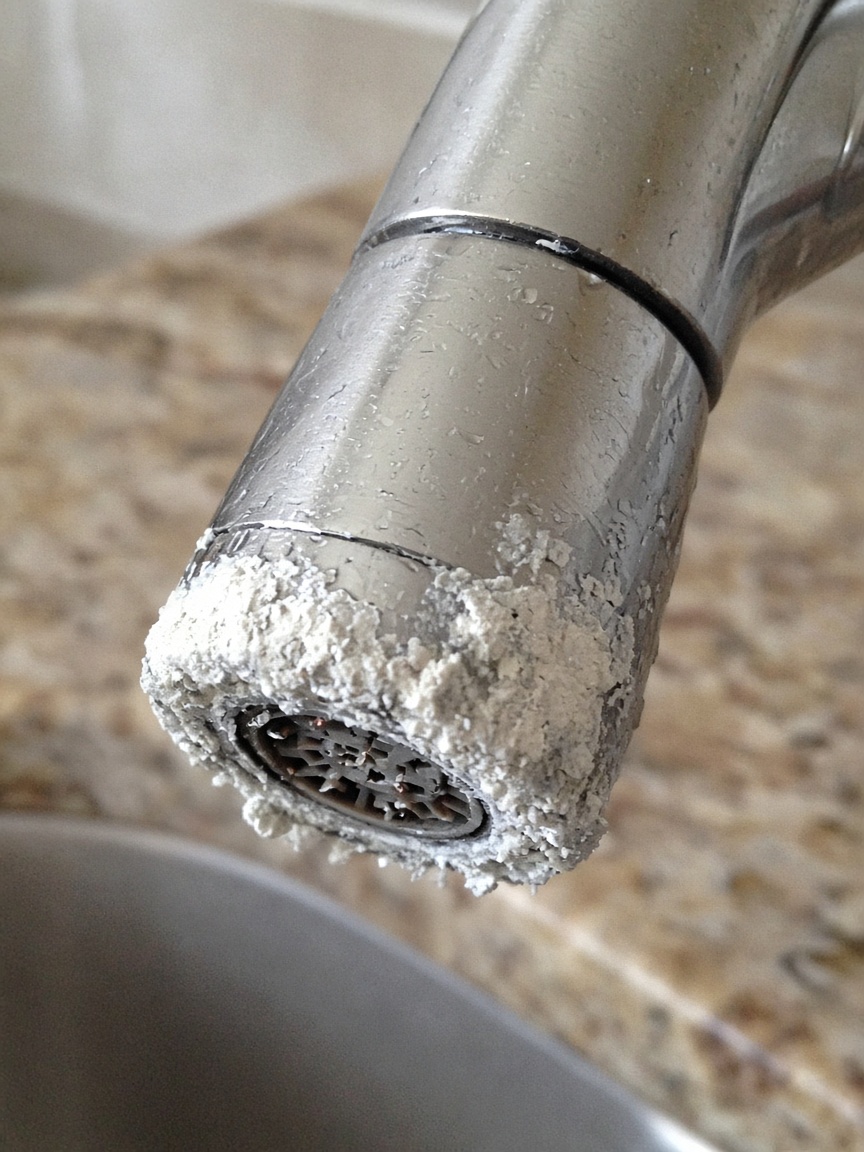 White crust on a kitchen faucet