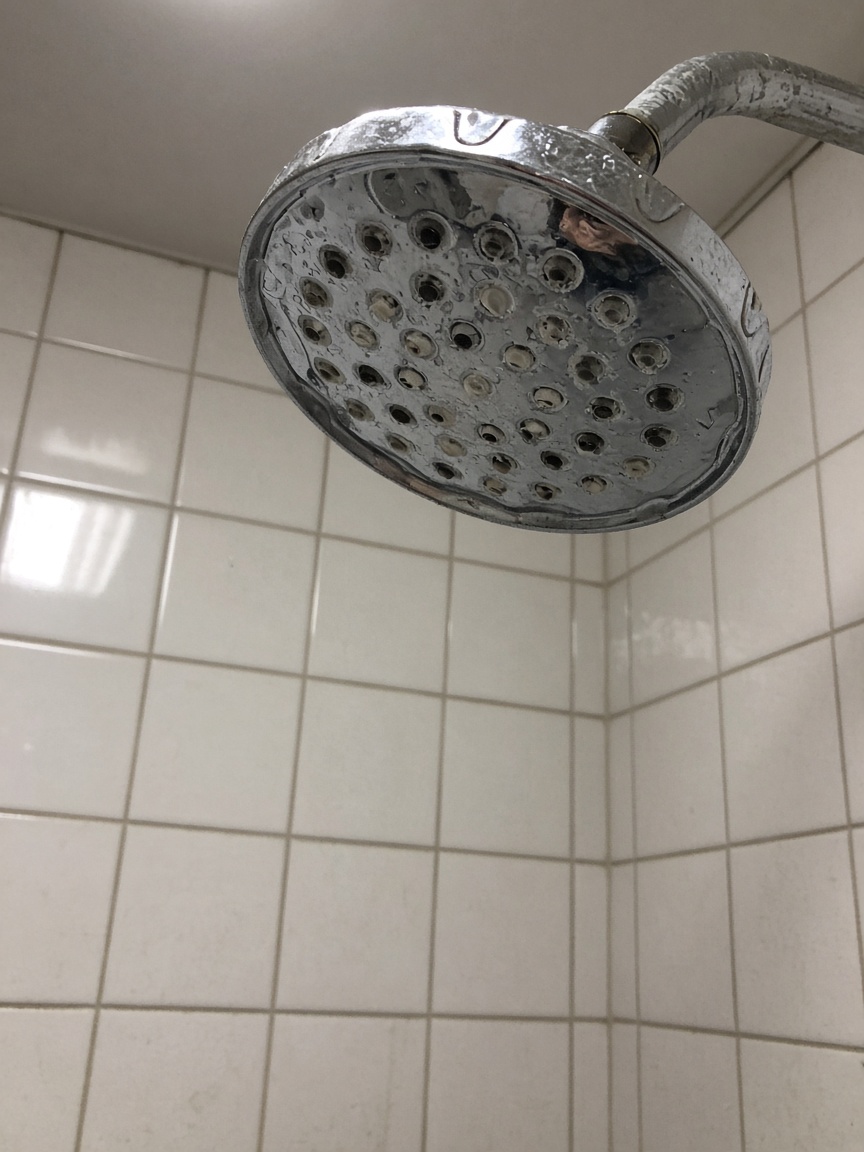 Shower head with clogged holes